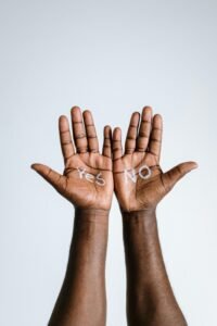 Image of hands with 'Yes' and 'No' text, demonstrating a choice or decision concept.